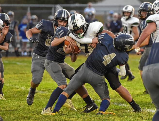 Franklin Tech’s Hunter Donahue (4) helps tackle McCann Tech’s Musa Thompson (7) during season-opening action in Turners Falls earlier this season. 