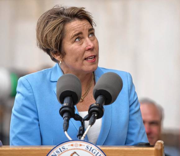 Gov. Maura Healey looks up at the construction of the Veterans Home in Holyoke during a “topping off” ceremony Thursday afternoon.