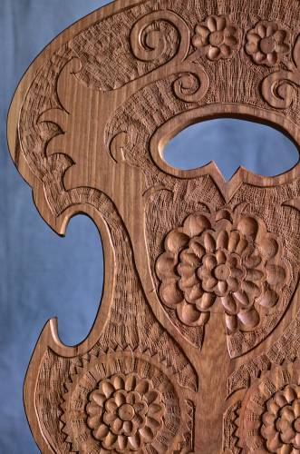 A close-up of hand-carved details in Charles Thompson’s woodwork.