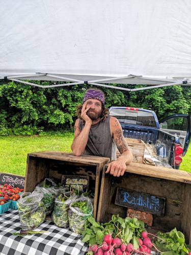 Jared Duval with what remains of his produce after a successful farmers market day for Coolidge Hill Farm.