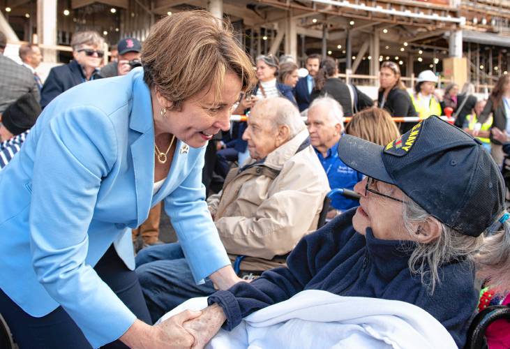 Gov. Maura Healey talks with Miriam Silverman, 100, a resident of the older building at the Veterans Home at Holyoke, during a “topping off” ceremony for the new facility on Thursday afternoon.