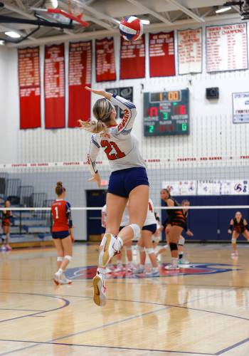 Frontier’s Olivia Machon (21) serves against South Hadley earlier this season at Goodnow Gymnasium in South Deerfield.