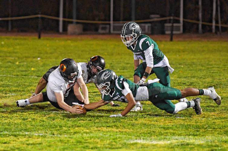 Greenfield’s Krish Patel recovers a fumble against Belchertown during the Green Wave’s 46-13 win at Veterans Memorial Field in Greenfield Friday night. 