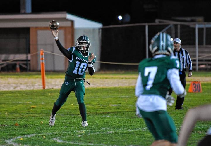 Greenfield’s Mason Cummings passes to Caleb Murray against  Belchertown during the Green Wave’s 46-13 win at Veterans Memorial Field in Greenfield Friday night. 