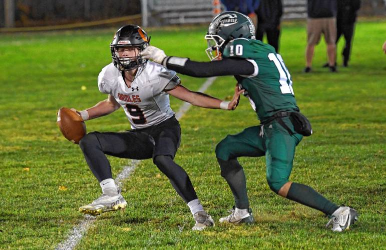 Belchertown’s Adam O’Rourke is pursued by Greenfield’s Mason Cummings during the Green Wave’s 46-13 win at Veterans Memorial Field in Greenfield Friday night. 