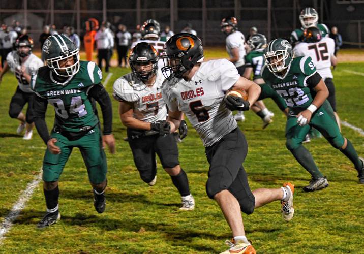 Belchertown’s Brian Fuller gains yards against Greenfield during the Green Wave’s 46-13 win at Veterans Memorial Field in Greenfield Friday night. 