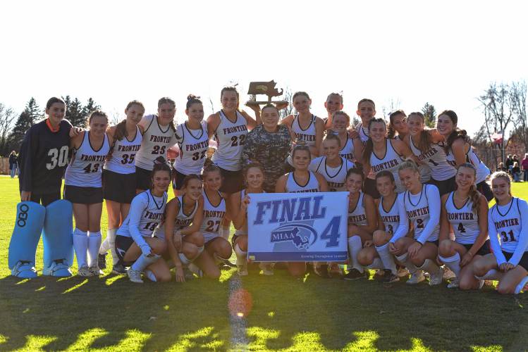 The Frontier field hockey team shows off its Final Four banner following their 2-0 win over Ipswich in the MIAA Division 4 quarterfinal round on Saturday in South Deerfield.