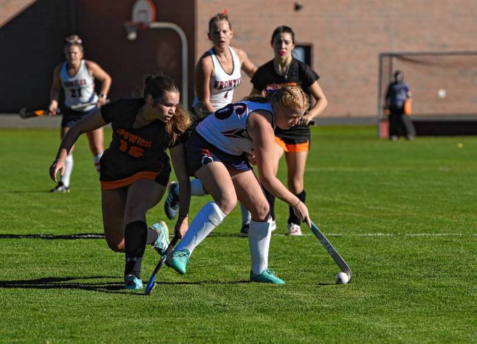 Frontier’s Abbi Grover, right, carries the ball during the Redhawks’ 2-0 win over Ipswich in the MIAA Division 4 quarterfinal round on Saturday in South Deerfield.