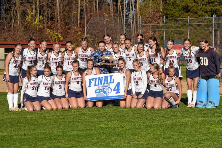 The Frontier field hockey team shows off its Final Four banner after beating Ipswich 2-0 in the MIAA Division 4 quarterfinal round on Saturday in South Deerfield.