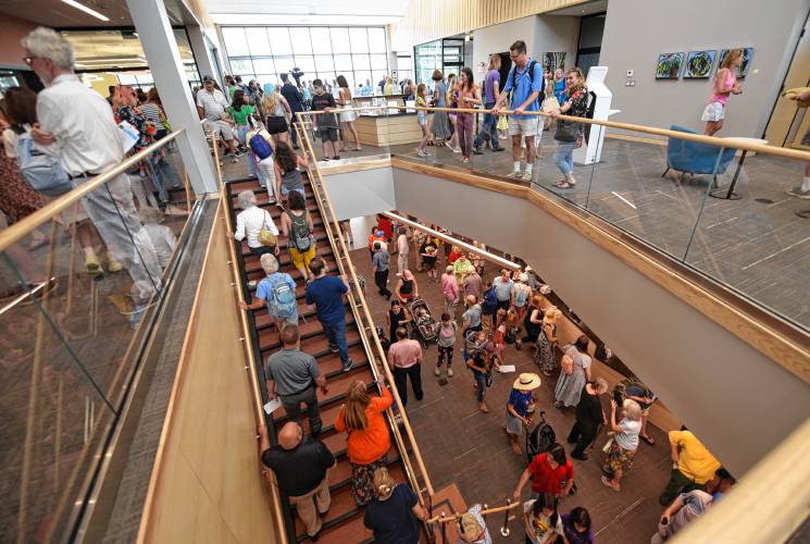 People pour into the Greenfield Public Library after its grand opening in July 2023.