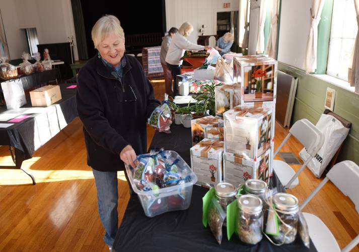 Cyndie Stetson and others get ready for the 2021 Silver Bell Bazaar, held at Mary Lyon Church and the Buckland Public Hall. The annual bazaar returns Saturday, Nov. 23, from 9 a.m. to 2 p.m.