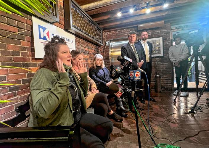 From left, plaintiffs Danyelle Bushee, Brittany Bushee and Melissa Chiasson join attorneys John McCarthy and Michael Kelly during a press conference in Boston on Tuesday morning to discuss their lawsuit after a neighbor’s tree struck them in August, causing serious injuries.