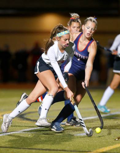 Frontier’s Elsa Brown (7) defends against Uxbridge’s Aubrey Bouchard (7) in the third quarter of the MIAA Div. 4 field hockey state semifinal Tuesday at Agawam High School.