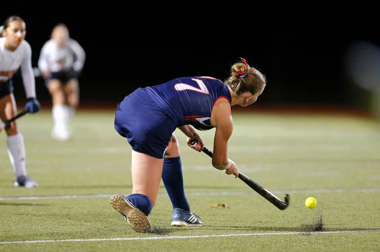 Frontier’s Elsa Brown (7) clears the ball upfield against Uxbridge in the first half of the MIAA Div. 4 field hockey state semifinal Tuesday at Agawam High School.