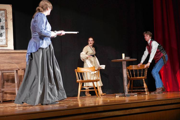 Emily Woods as Lady Bracknell, Eliza Van Driesche as Gwendolen and Mason Smith as Jack rehearse a scene from “The Importance of Being Earnest” being put on by Frontier Regional School in South Deerfield. Performances start Friday.