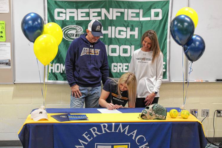 Greenfield’s MacKenzie Paulin signs her National Letter of Intent on Wednesday to play softball at Merrimack College next fall. 