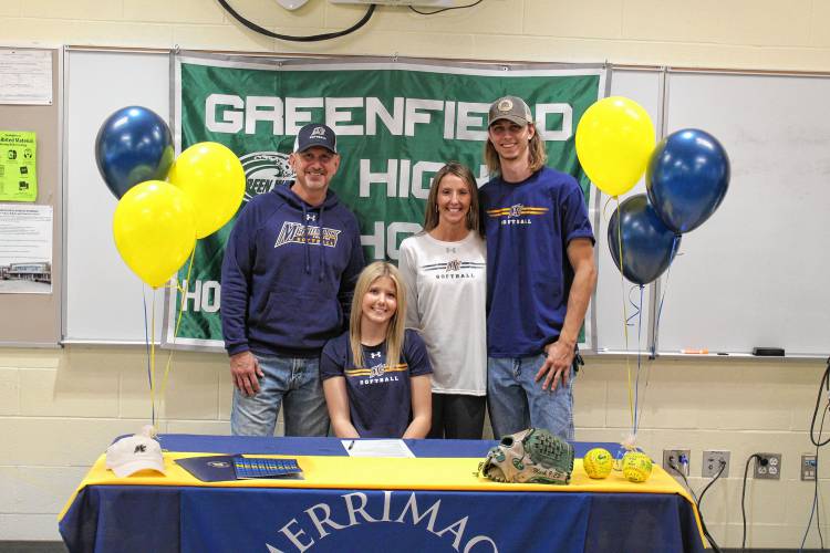 Greenfield’s MacKenzie Paulin with her father Marcus Paulin, mother Jennifer Paulin and brother MJ Paulin after signing her National Letter of Intent on Wednesday to play softball at Merrimack College next fall.  