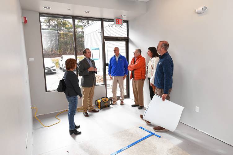 Children’s Advocacy Center of Franklin County and the North Quabbin Executive Director Jeffrey Trant, second from left, leads Greenfield Cooperative Bank staff on a tour of the center’s future Orange location on Monday, Oct. 28. The bank donated $30,000 to the center.