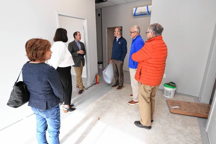 Children’s Advocacy Center of Franklin County and the North Quabbin Executive Director Jeffrey Trant, third from left, leads Greenfield Cooperative Bank staff on a tour of the center’s future Orange location on Monday, Oct. 28. The bank donated $30,000 to the center.