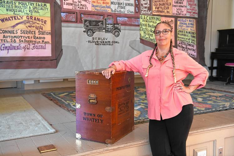 Whately Town Clerk Amy Lavallee, pictured with the town’s  historical ballot box in the Town Hall in September.