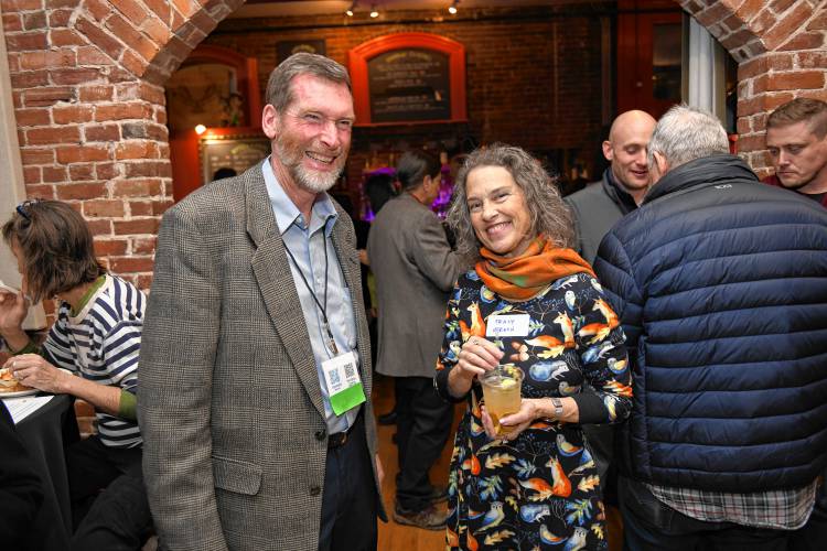 Franklin County Community Development Corporation Executive Director John Waite speaks with Montague resident Tracy Vernon during the Franklin County CDC’s 45th annual meeting at Hawks & Reed Performing Arts Center in Greenfield on Wednesday.