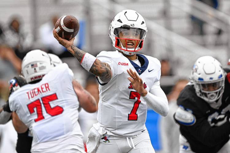 Liberty quarterback Kaidon Salter (7) passes against Middle Tennessee during the Flames’ 37-17 victory last weekend in Murfreesboro, Tenn.