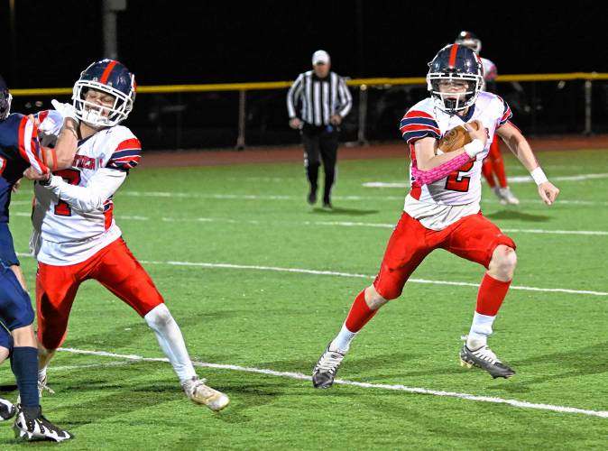 Frontier’s Garrett Dredge gains yardage against Mahar in Orange Friday night. 