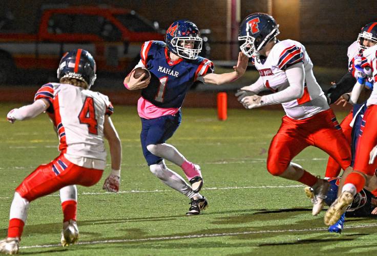 Mahar’s Morgan Softic fends off Frontier defenders in Orange Friday night.