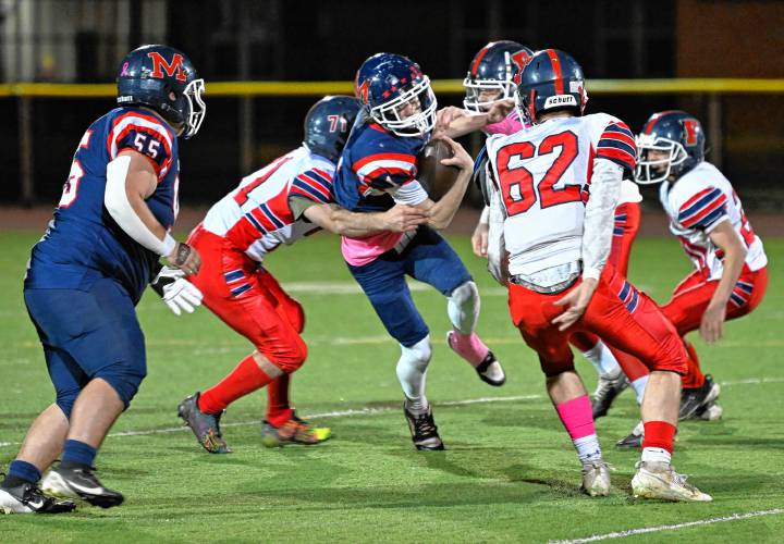 Frontier closes in on Mahar's Morgan Softic in Orange Friday night.