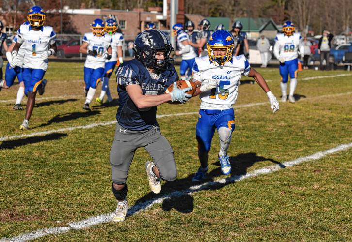 Franklin Tech’s Ethan Smarr (5) tries to escape Assabet Valley’s Jayden Alvarez (15) after making a reception during the Eagles’ 20-14 loss in the state vocational quarterfinals on Saturday in Turners Falls.