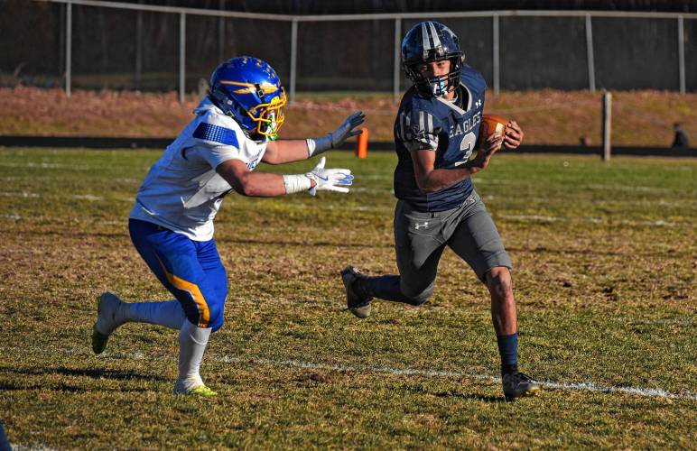 Franklin Tech’s Nolyn Stafford (3) tries to avoid an Assabet Valley tackler during the Eagles’ 20-14 loss in the state vocational quarterfinals on Saturday in Turners Falls.