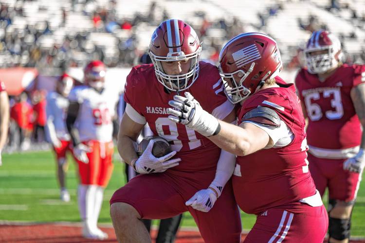 UMass tight end Dom Mazotti celebrates a two-point conversion during the Minutemen’s 35-34 overtime loss to Liberty on Saturday at McGuirk Alumni Stadium in Amherst.