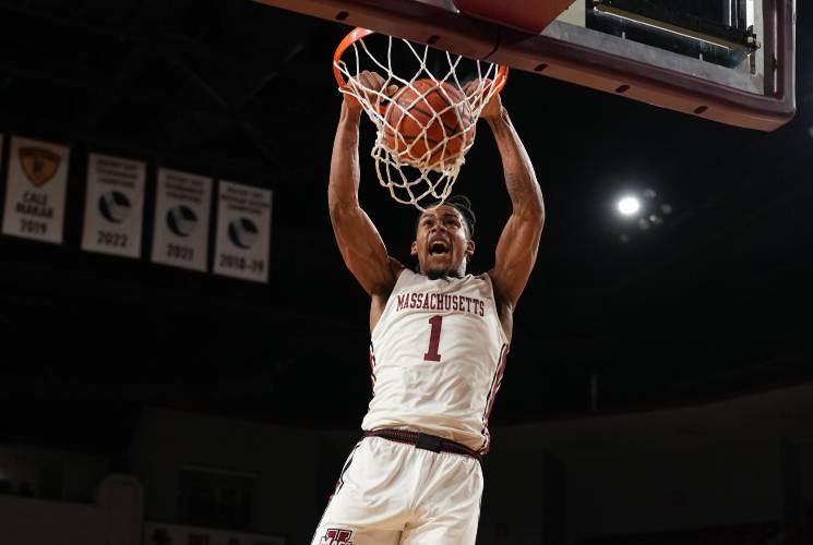 UMass’ Daniel Hankins-Sanford goes in for a dunk against Hofstra during the Minutemen’s 75-71 overtime loss on Saturday night at the Mullins Center.