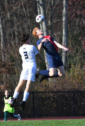 Frontier’s Will Reading heads the ball against Nantucket’s Ryan Coleman in South Deerfield during an MIAA Div. 4 Round of 32 contest this season.  