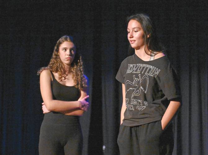 Amelia Hescock and Sophia Wood rehearse a scene for Pioneer Valley Regional School’s production of “This Changes Everything” by Joel Horwood. The public is invited to two showings on Friday, Nov. 22, and Saturday, Nov. 23, each at 7 p.m.