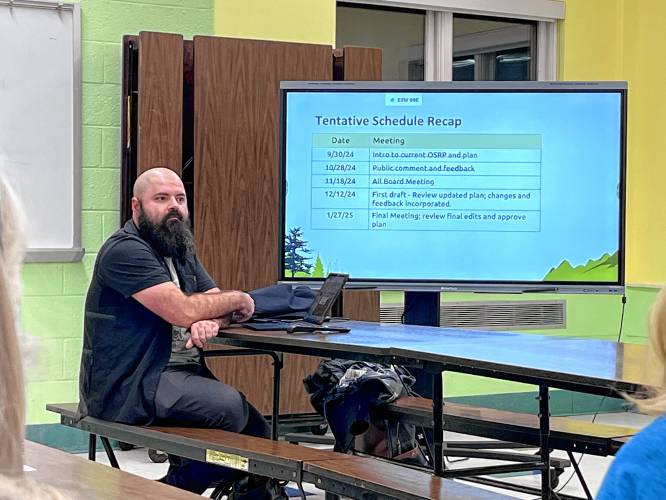 Selectboard Chair Valentine Reid presents the hopeful timeline for updating Charlemont’s Open Space and Recreation Plan during a meeting of all town boards and committees at Hawlemont Regional School on Monday.