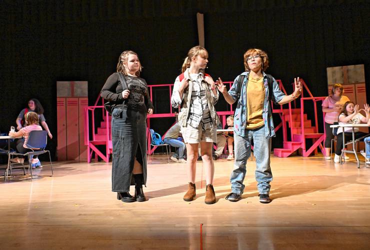 Marketa Vachula-Curtis as the new girl Cady Heron, center, with her friends Janis, left, played by Lila Argy, and Damian, right, played by Ash Shipley-Aja, during a scene from “Mean Girls Jr.” at Turners Falls High School and Great Falls Middle School on Wednesday. Performances are set for Thursday, Nov. 21 through Sunday, Nov. 24.