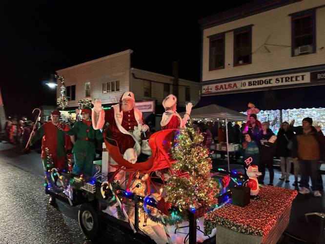 Santa and Mrs. Claus wave to onlookers during the 2022 Moonlight Magic parade through Shelburne Falls. This year the event takes place Nov. 29 from 4 to 9 p.m.