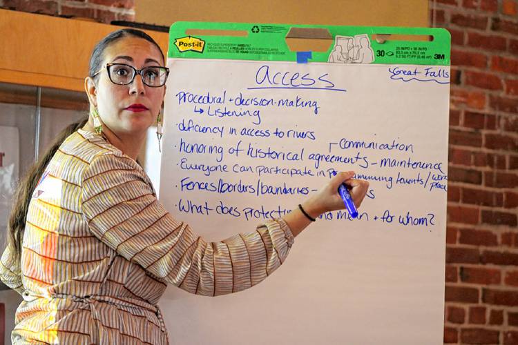 Leah Hopkins, the state Department of Conservation and Recreation’s new Indigenous peoples partnership coordinator, takes suggestions from attendees at the Great Falls Discovery Center in Turners Falls on Wednesday about the term “access” when it comes to the role DCR plays as an agency.