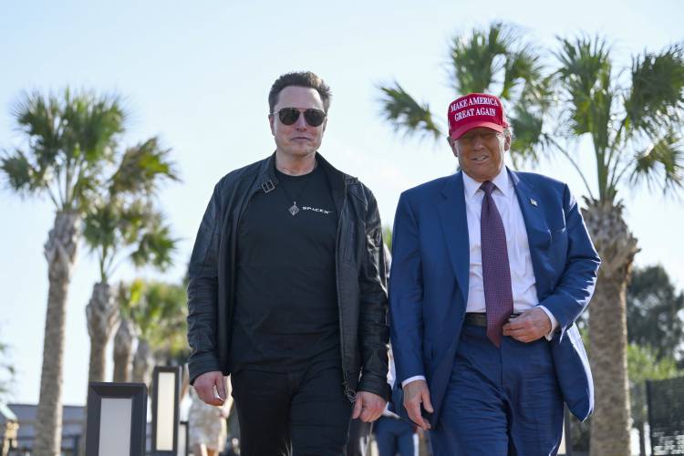 President-elect Donald Trump walks with Elon Musk before the launch of the sixth test flight of the SpaceX Starship rocket Tuesday, Nov. 19, 2024 in Boca Chica, Texas.