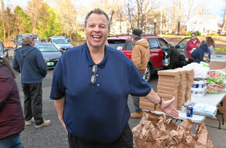 Local DJ Robert “Bobby C” Campbell at the Bernardston Senior Center distributing Thanksgiving meals on Friday afternoon.