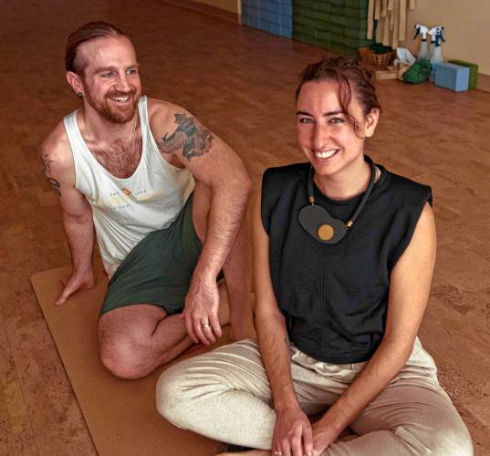 Michael Shick and Alice Feldman, co-owners of Resonance Hot Yoga and Massage, in their hot yoga studio in Amherst.