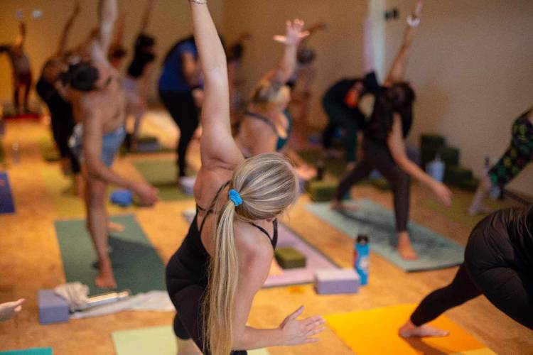 Participants in a yoga class at Resonance Hot Yoga and Massage in Amherst.