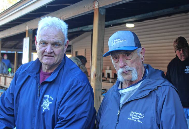 Ray Zukowski, a supervisor with the Franklin County Sheriff’s Office TRIAD Program, left, and Chet Czernich, a member of the Thomas Memorial Golf & Country Club in Turners Falls, organize the assembling of 150 Thanksgiving food boxes for people in need in Franklin County.