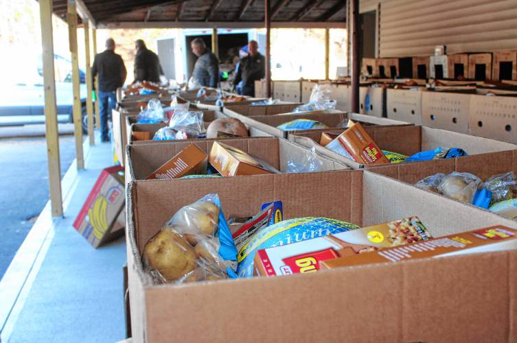 For the sixth consecutive year, members of the Thomas Memorial Golf & Country Club in Turners Falls and the Franklin County Sheriff’s Office TRIAD Program got together to assemble 150 boxes of food for people in need in Franklin County. Volunteers convened at the Schuetzen Verein in Gill on Monday morning to pack up the fixings for a Thanksgiving meal to be distributed to families in time for the holiday.