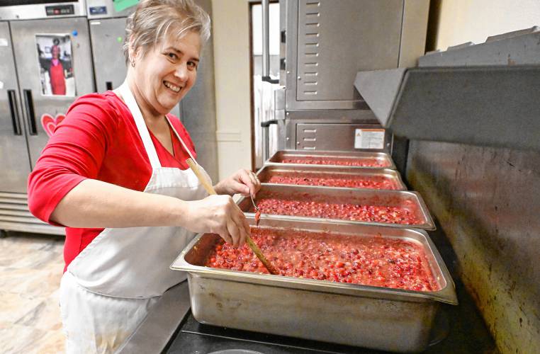 Kirsten Levitt, executive director and chef at Stone Soup Café in Greenfield, cooking up vats of cranberry sauce in advance of the Thanksgiving meal.