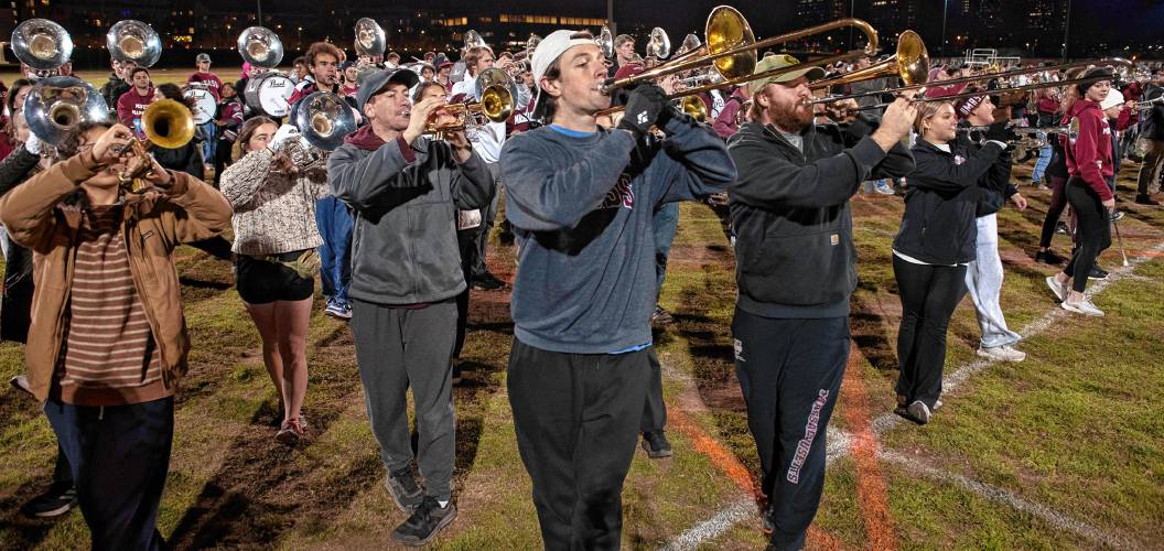 Sam Hunt, front middle, a member of the UMass marching band, practices with about 400 other members for the Macy’s Thanksgiving Day Parade.