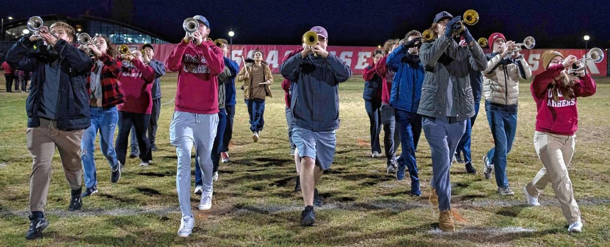 Christine Ziadeh, back, runs to catch up while keeping time for a section of the UMass marching band while practicing for the Macy’s Thanksgiving Day Parade. 