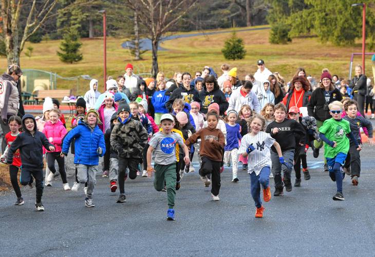 Students at Bernardston Elementary School participate in the annual turkey trot starting by grade group on Wednesday morning.