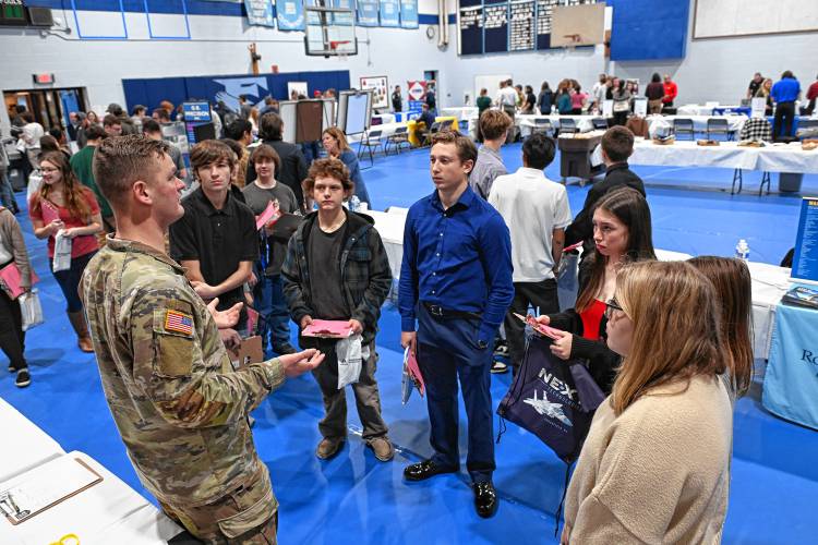 Sgt. Paul McCrohan of the Army National Guard, left, talks with juniors and seniors at Franklin County Technical School during a career and college expo on Tuesday.